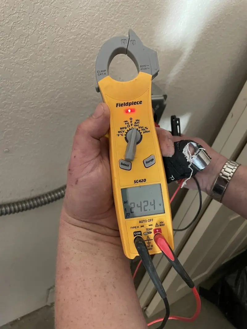 Voltage testing with clamp meter during Whole House Surge Protector in Bar Harbor